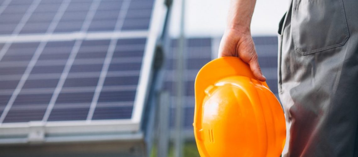 man-worker-in-the-firld-by-the-solar-panels-1024x683